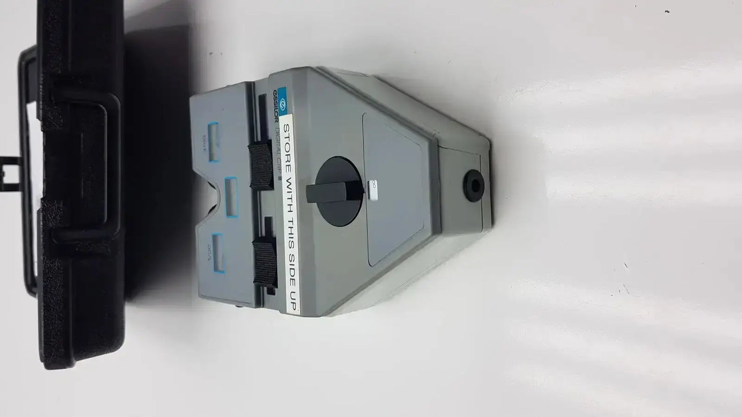 Gray plastic hp printer cartridge with black accents and circular dial for essilor x81701 precision digital crp device
