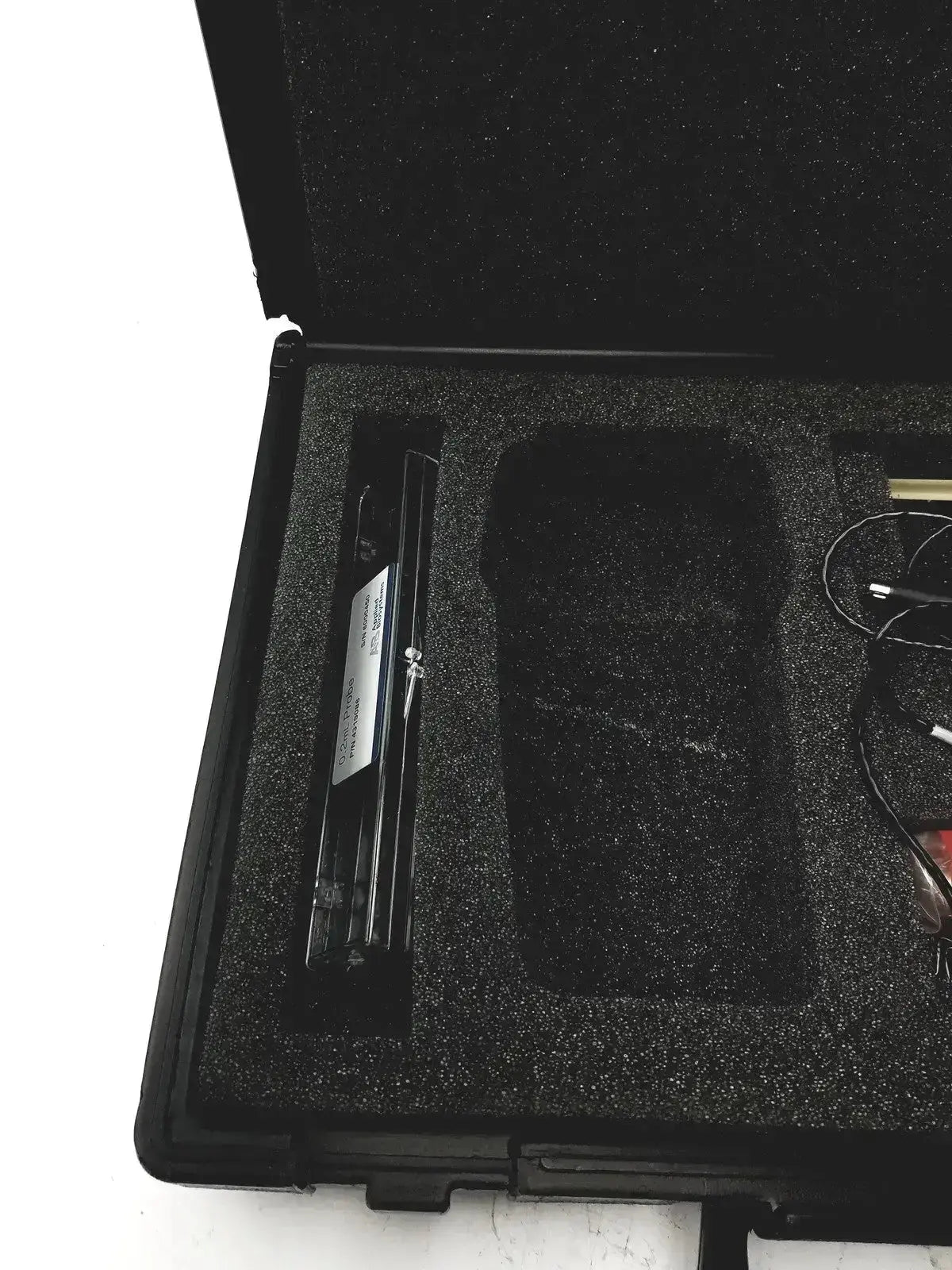 Black foam-lined case with eutechninc precision temperature 4500 thermo meter device and various cables inside