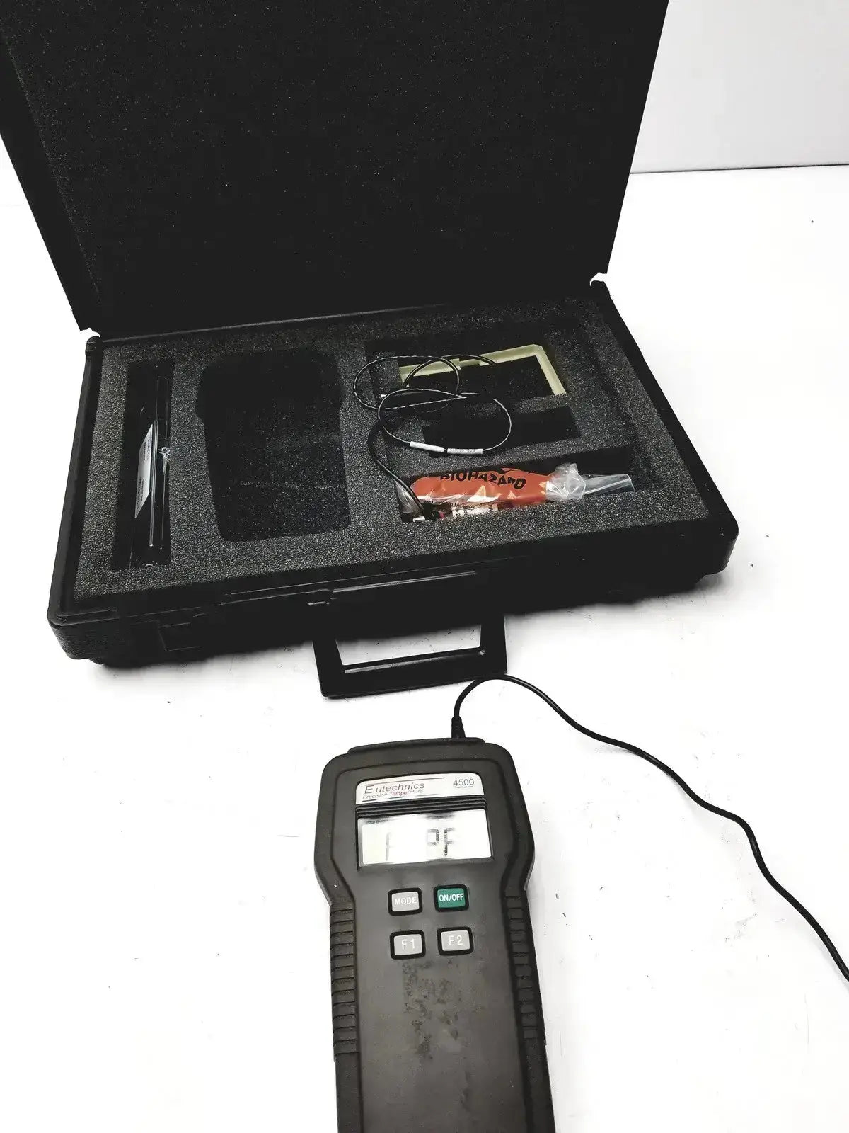 Black handheld eutechninc precision temperature thermo meter with digital display and control buttons for precise readings