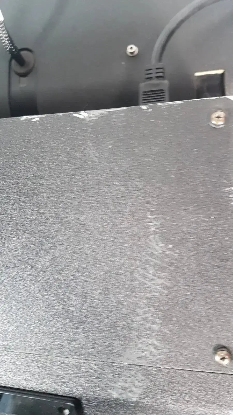 Gray textured metal panel with screws and minor scratches on the excellent spex 6850 freezer mill for biomedical evaluation