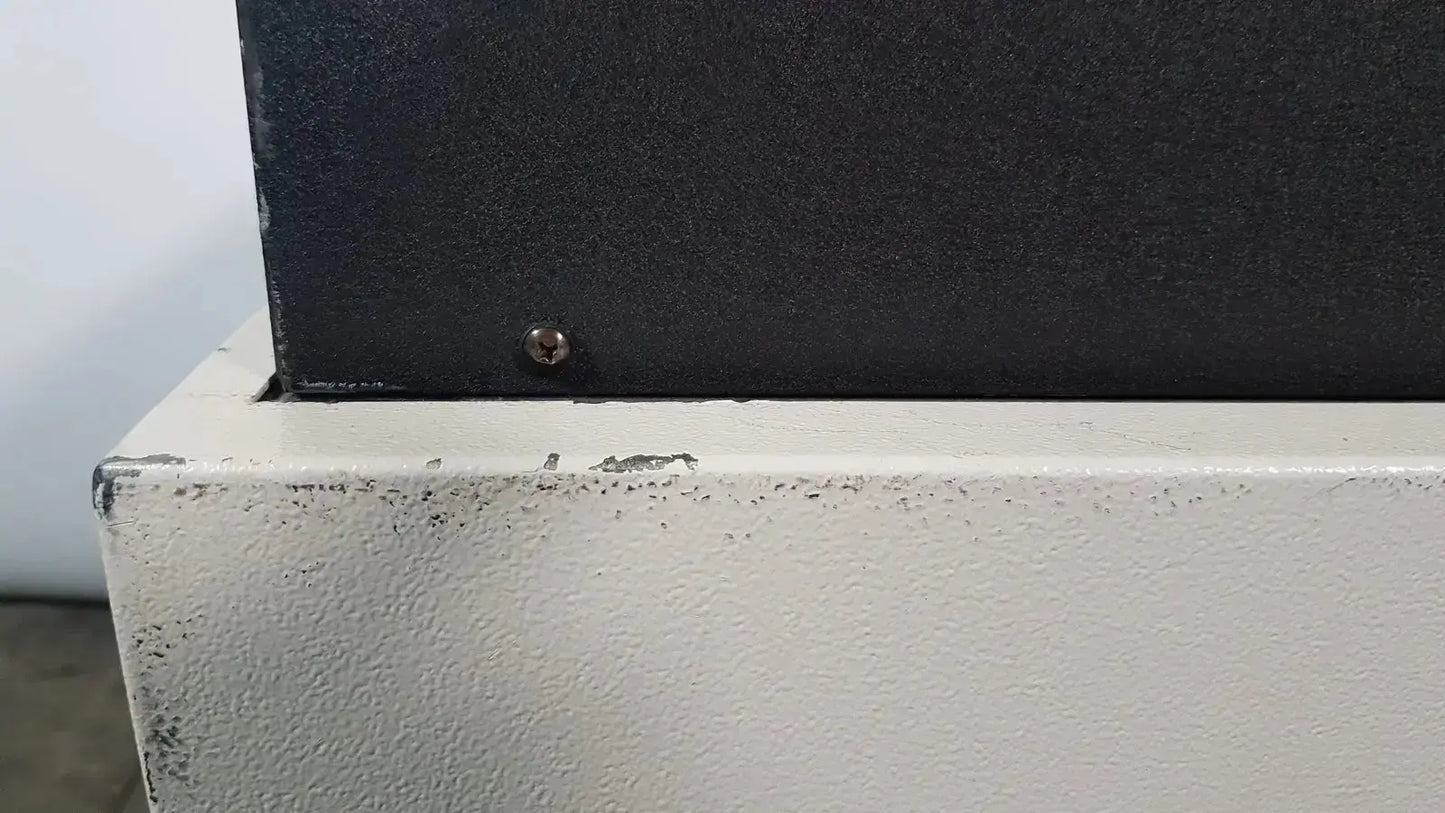 Black textured top panel mounted on white painted base with chipped paint and screw fastener on excellent spex 6850 freezer mill