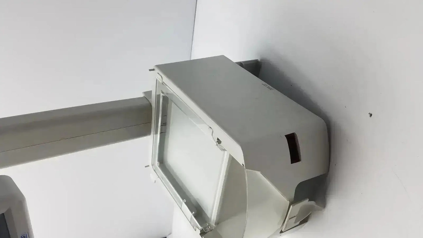 Gray rectangular outdoor floodlight with clear protective cover and mounting bracket by gse mode for hospital surplus use
