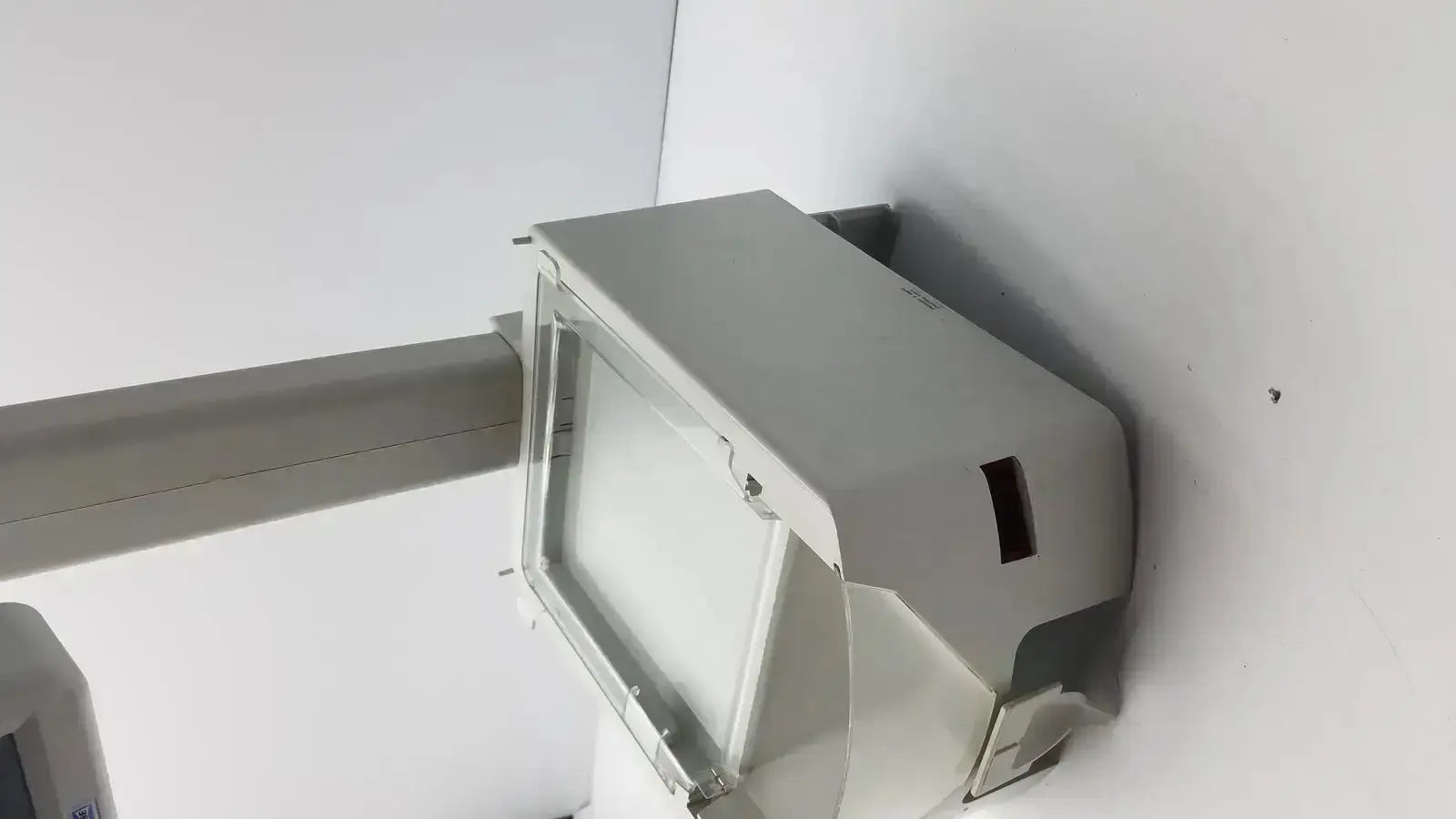 Gray rectangular outdoor floodlight with clear protective cover and mounting bracket by gse mode for hospital surplus use