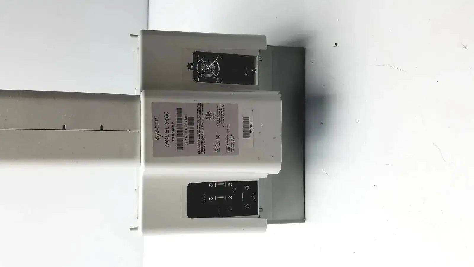 White plastic gse mode eyecon medical imaging device with black control panel labeled ge versa model 9400 for hospital surplus