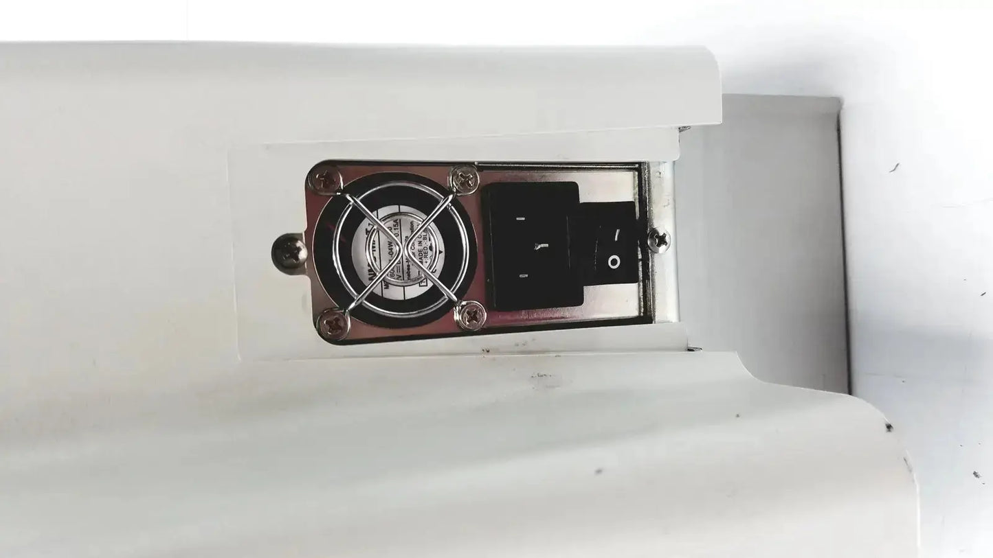 White plastic housing of the eyecon by gse mode 9400 with circular fan and black power switch for hospital surplus pill counter