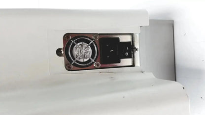 White plastic housing of the eyecon by gse mode 9400 with circular fan and black power switch for hospital surplus pill counter
