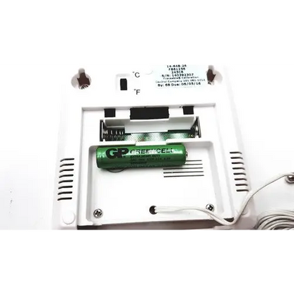 Green gp greencell battery nestled in a white plastic compartment.