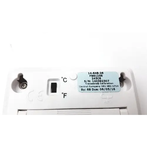 White plastic thermostat with a light blue label displaying serial and calibration information