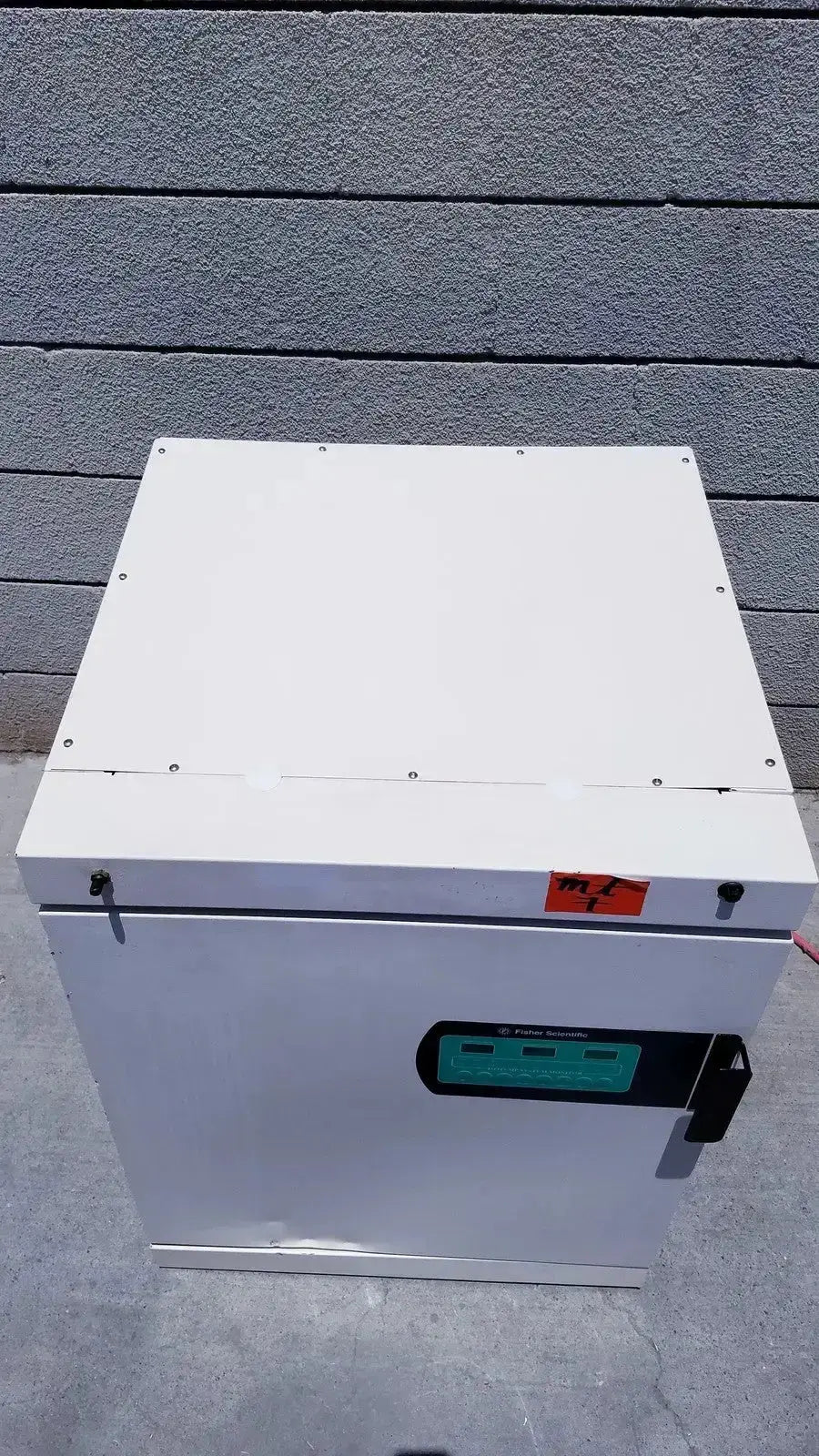 White industrial-grade fisher scientific co2 incubator cabinet with green digital control panel and black handle