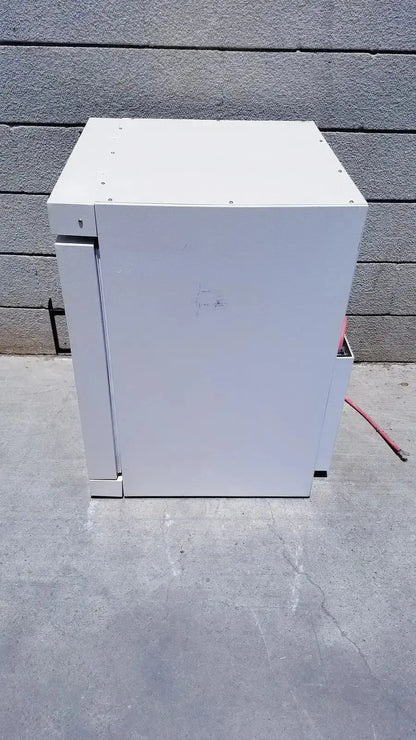 White metal industrial cabinet with hinged door and mounting screws of fisher scientific co2 incubator 116885h
