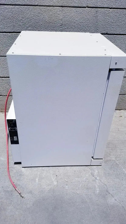 White industrial-grade metal electrical enclosure with mounting screws on the Fisher Scientific CO2 incubator 116885H