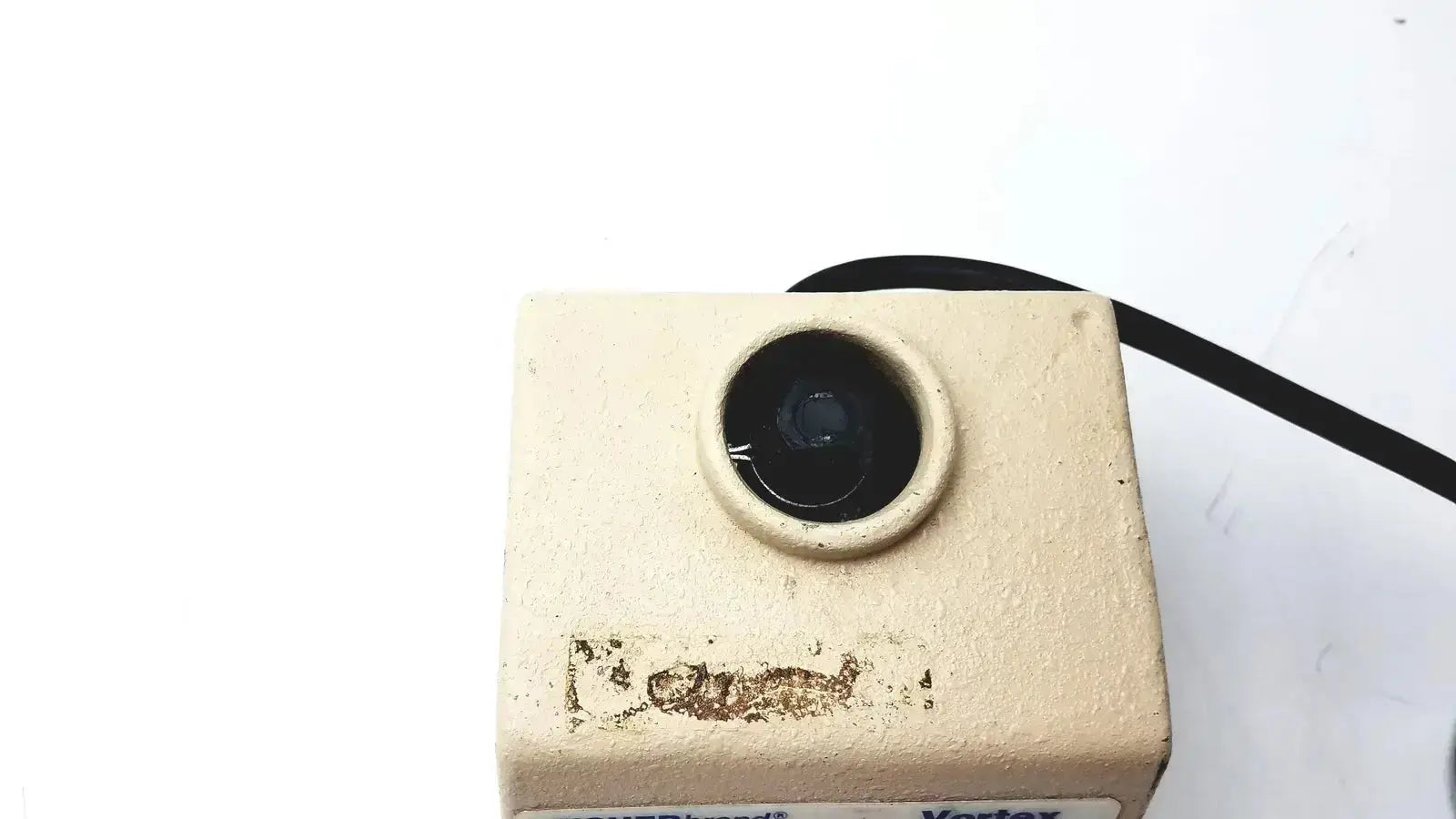 Beige square-shaped fisher scientific vortex genie 2 vortexer with black lens and visible surface wear