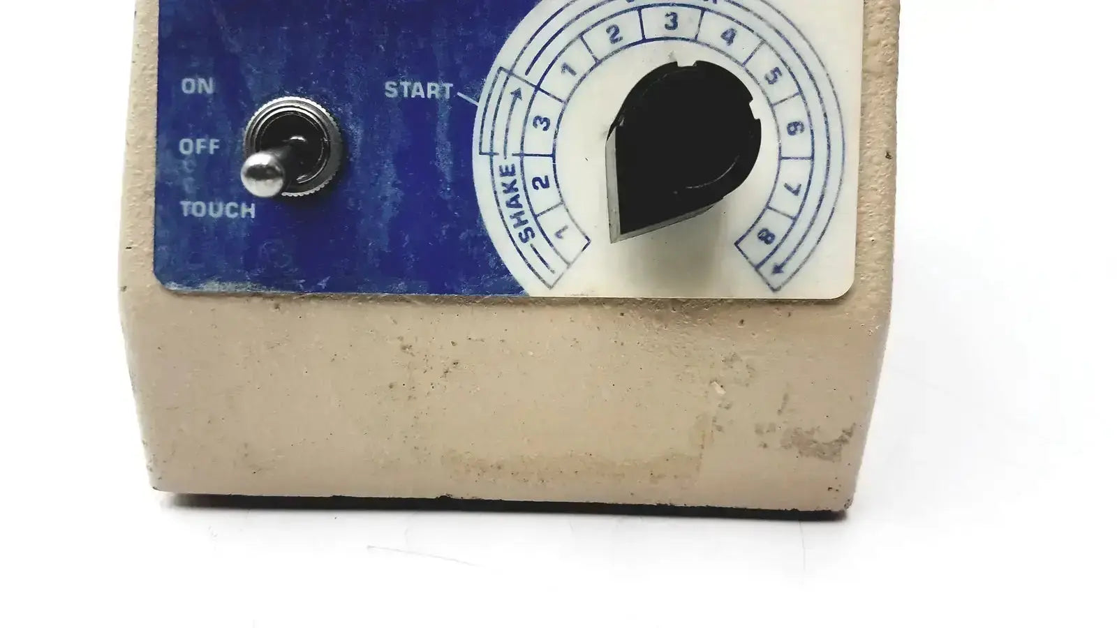 Beige plastic fisher scientific vortex genie 2 vortexer with blue control panel and numbered shake dial settings