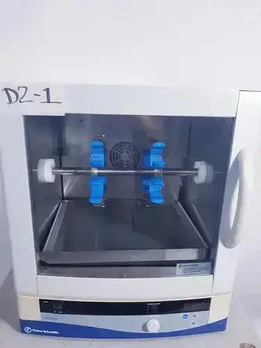 White and blue fisher scientific isotemp hybridization rotisserie incubator with transparent door and internal rotating rack