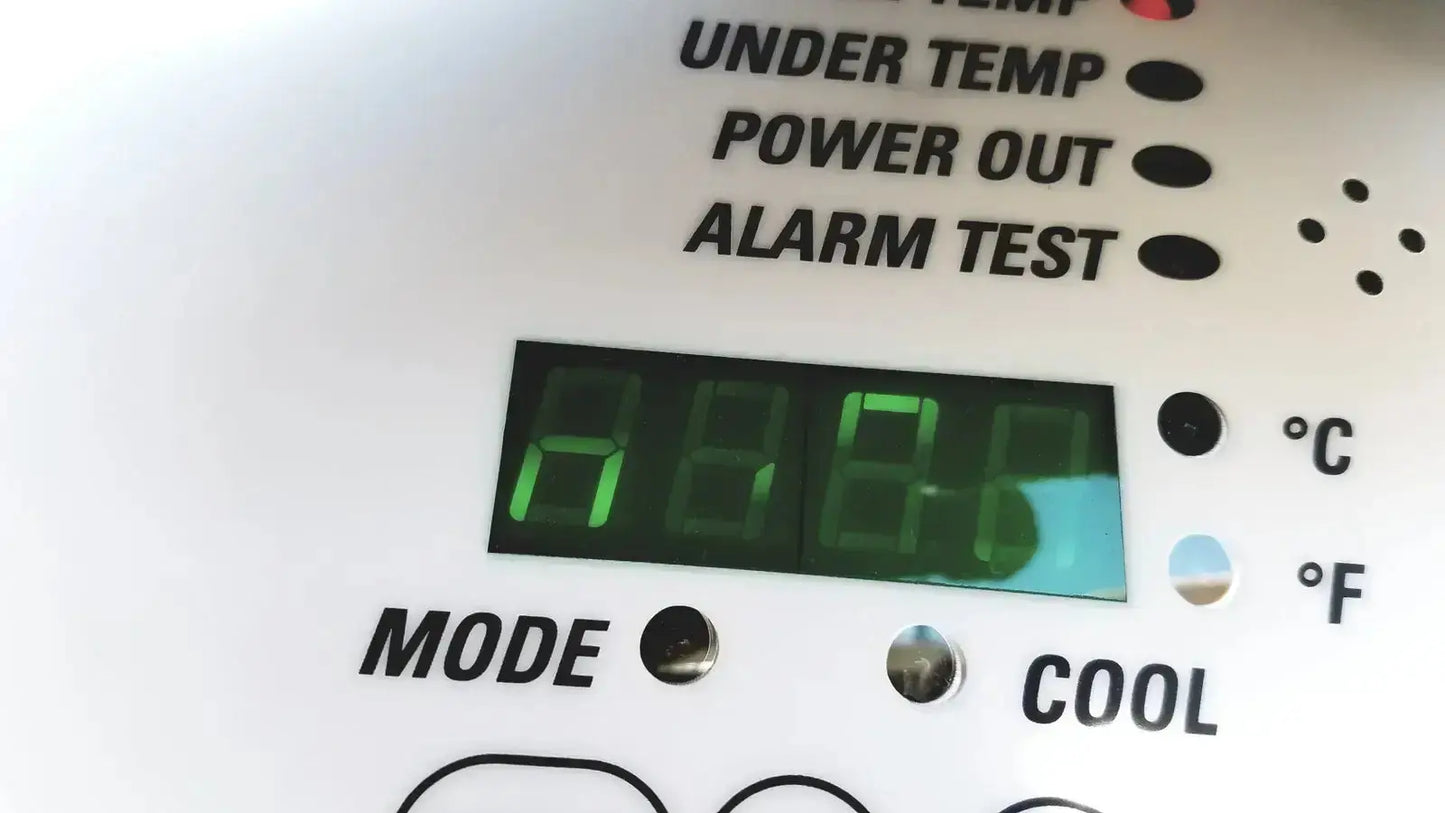 White digital thermostat with green led displaying a80 on fisher scientific isotemp laboratory freezer refrigerator