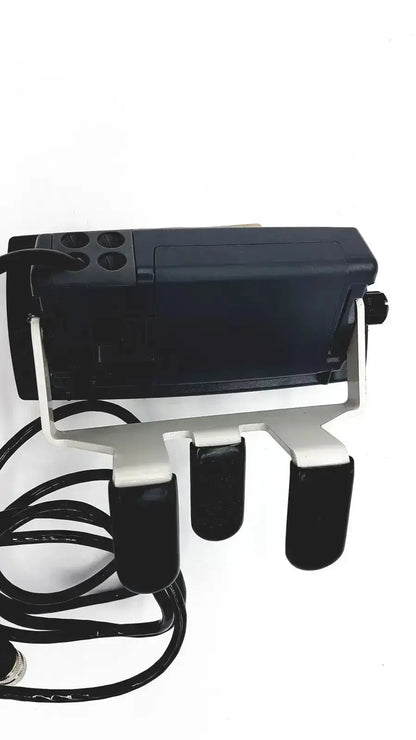 Black plastic device with silver metal stand and three foot pedals compatible with med-mizer allcare beds