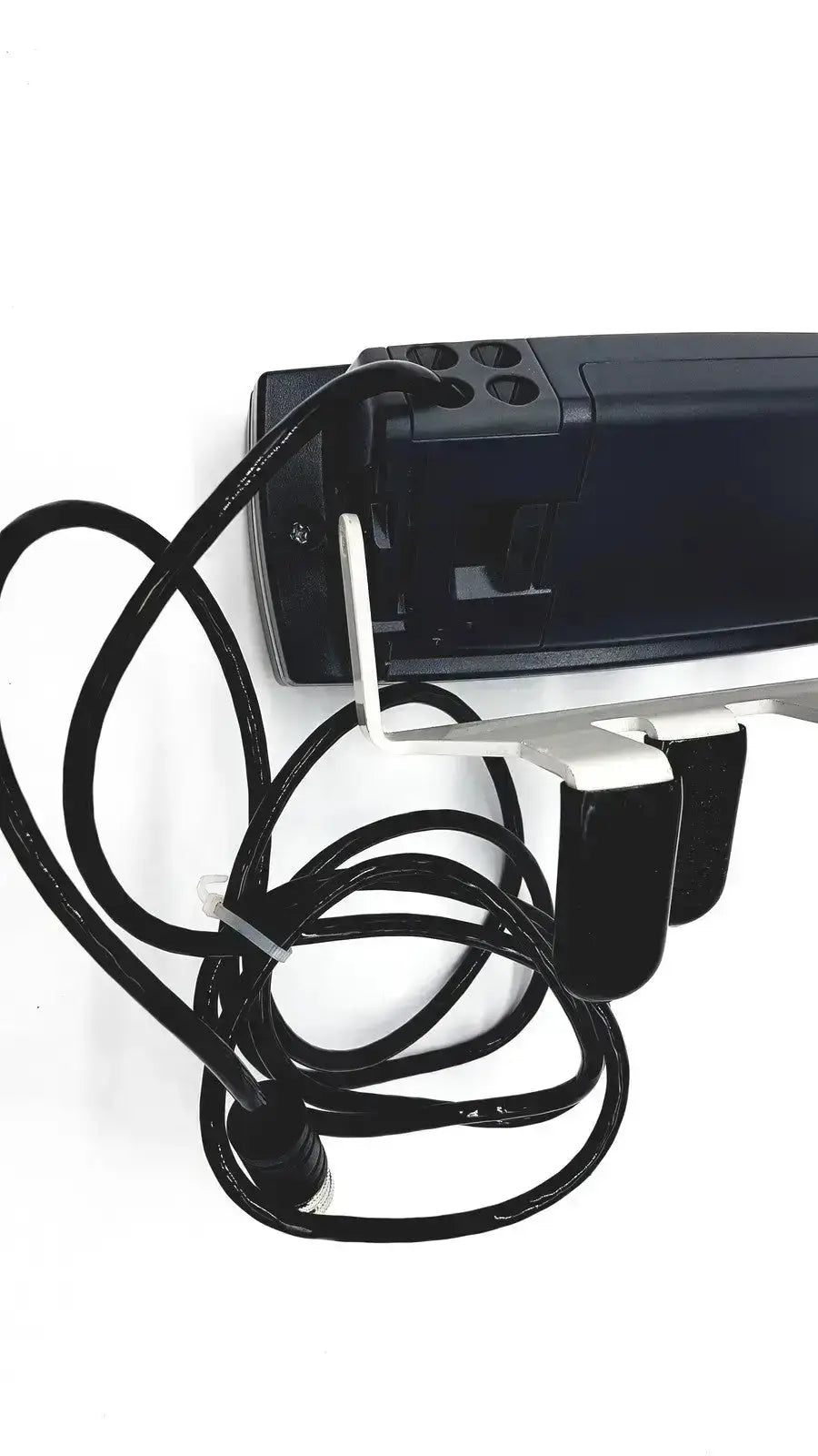 Black plastic device with coiled cable and white metal clip attachment fits med-mizer allcare beds