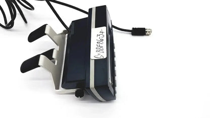 Black and silver dual-joystick gaming controller with matte finish and ergonomic foot pedals for med-mizer allcare beds