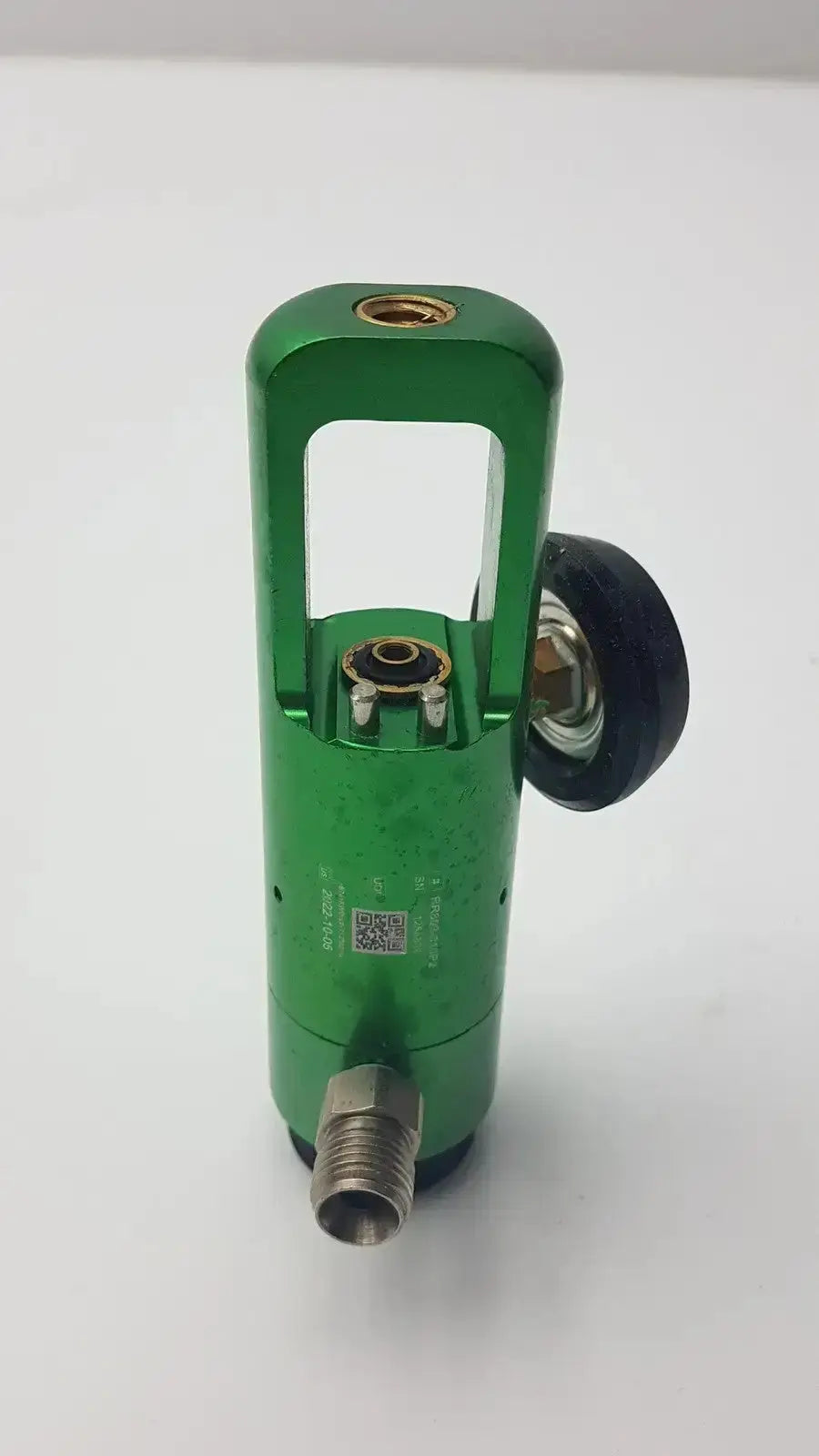 Green metallic flotec oxygen regulator with black rubber knob and threaded fittings for pre owned medical equipment sale