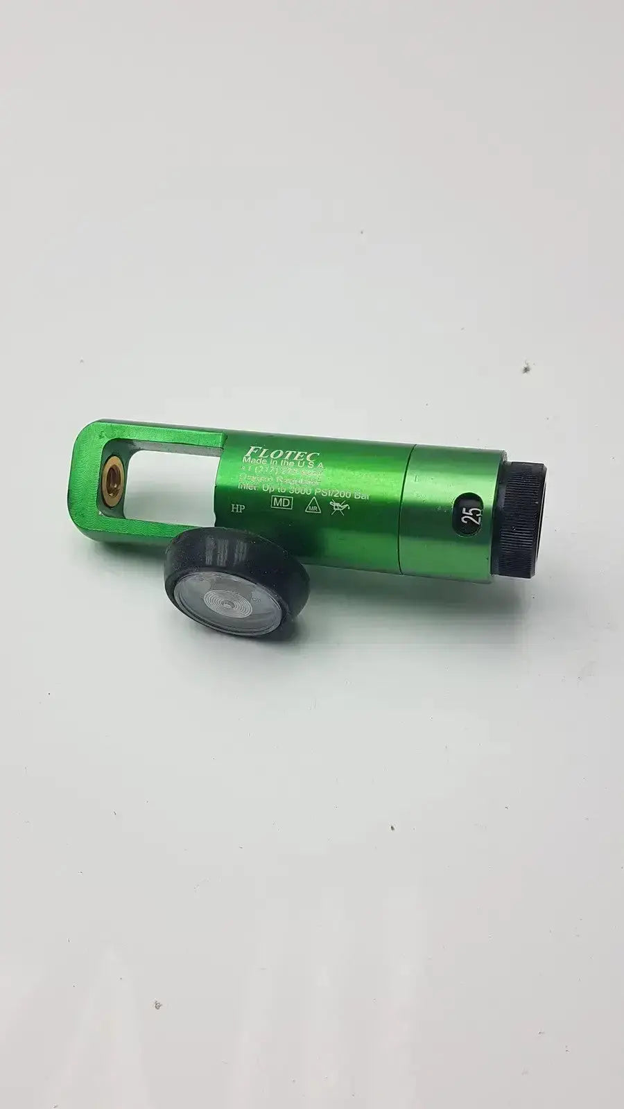 Green metallic flotec oxygen regulator with black rubber grip and circular dial for pre owned medical equipment use