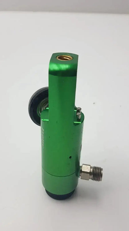 Green metallic flotec oxygen regulator with black rubber seal and threaded metal fittings for medical equipment sale