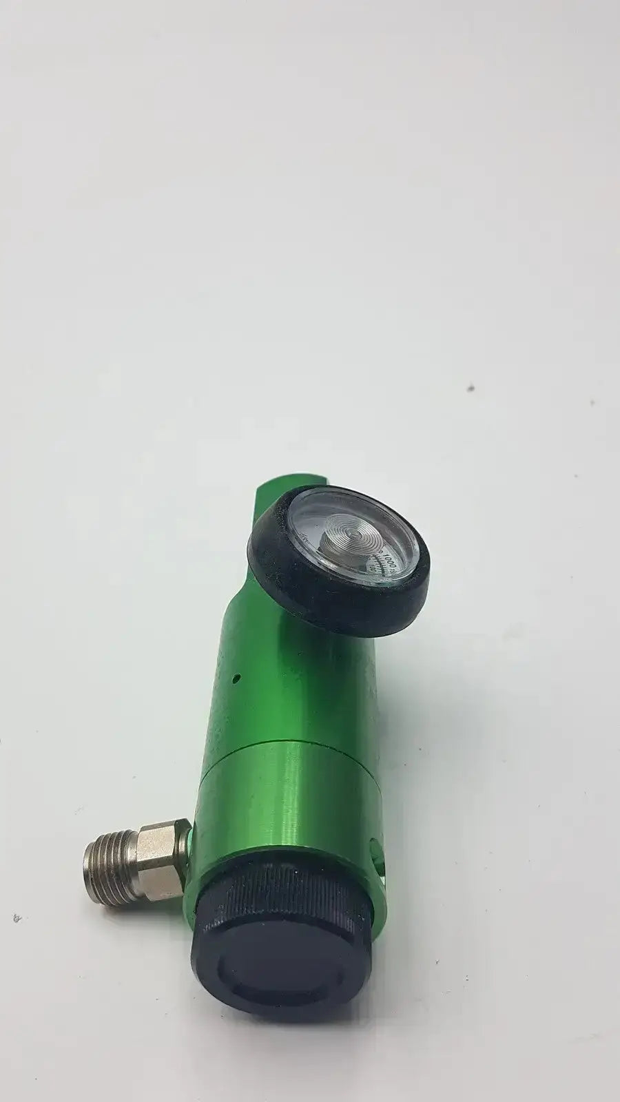 Flotec oxygen regulator in green metallic with black knob and gauge for pre owned medical equipment use up to 3000 psi