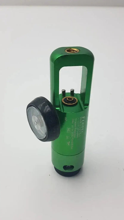 Green metallic flotec oxygen regulator with black circular gauge and engraved text for used medical equipment sale