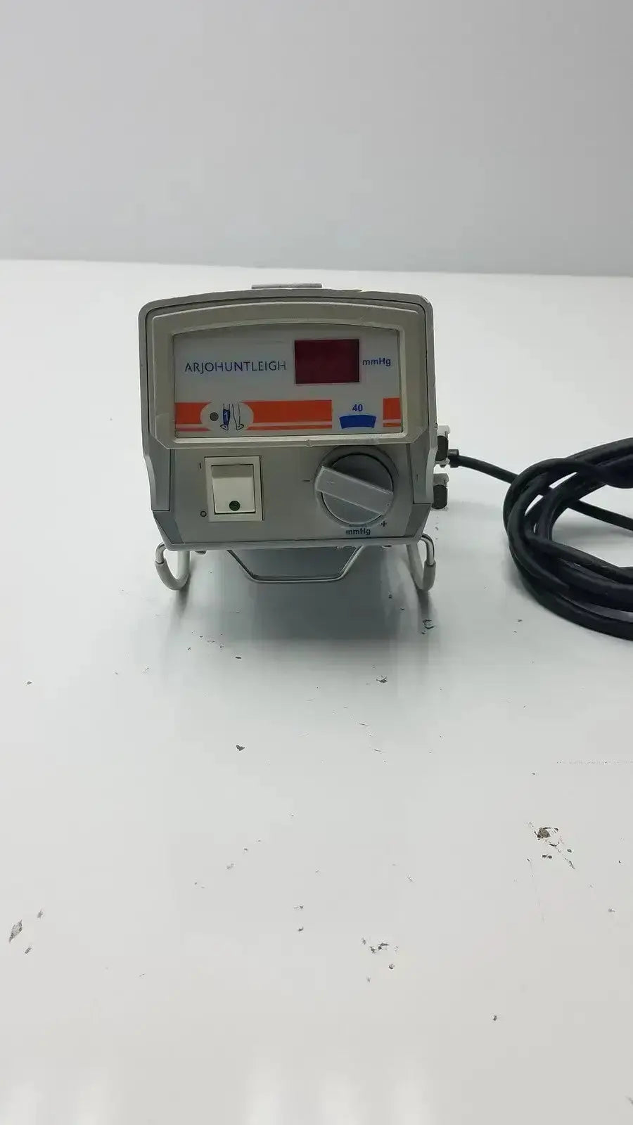 Gray arjowentleigh flowtron excel ac550 medical device with red digital display, orange blue markings, and black power cord