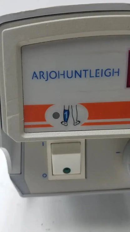 White plastic arjohuntleigh ac550 device with orange stripe and blue text from the flowtron excel series