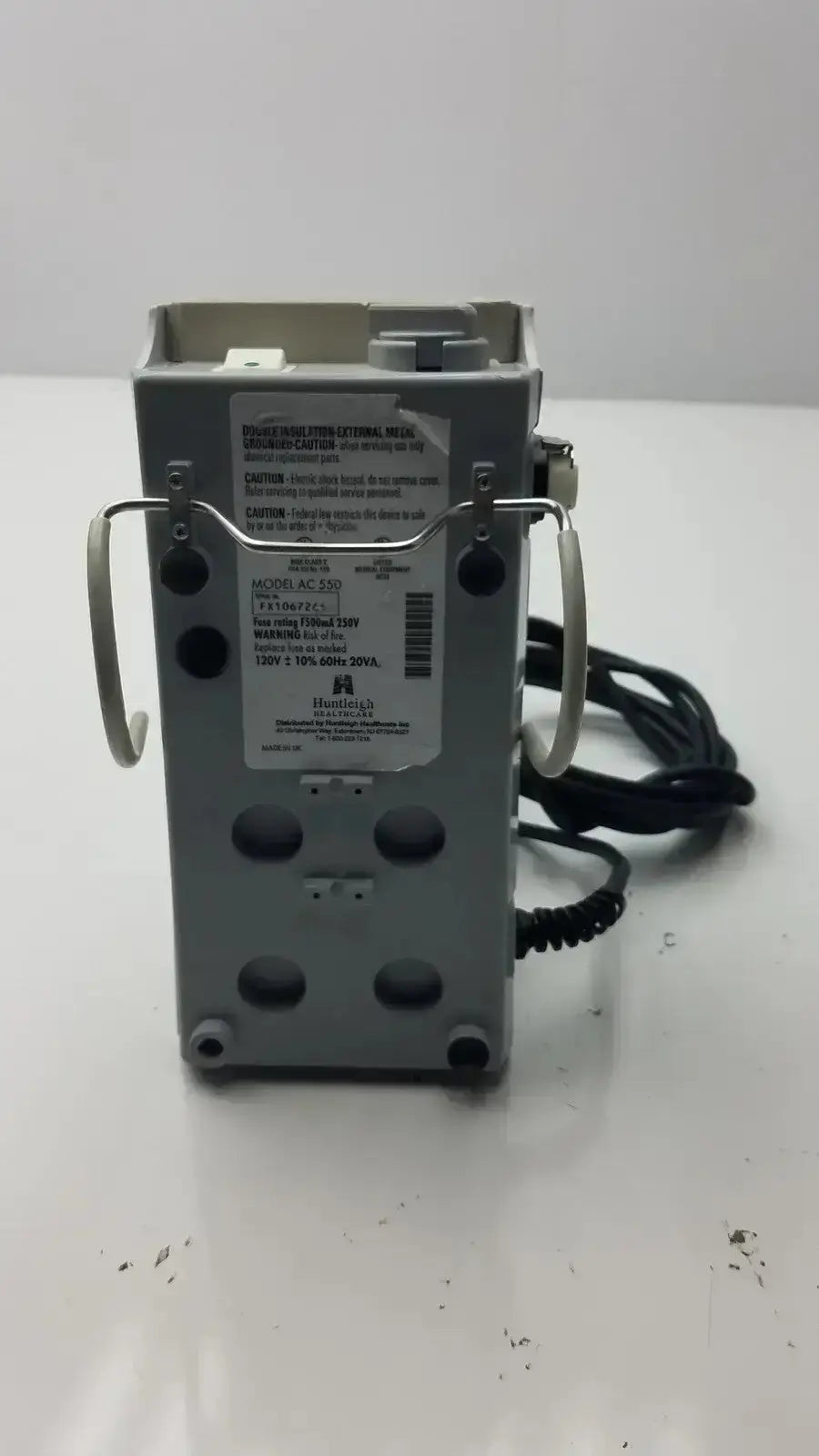 Gray metal medical device with two silver handles and coiled black cable huntleigh flowtron excel ac550 model