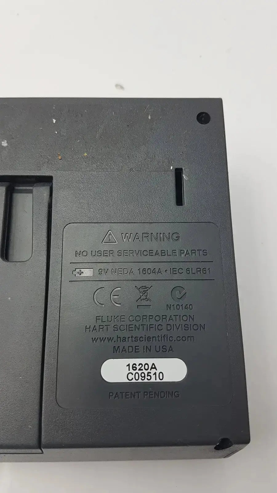 Back side of black plastic fluke 1620a dewk digital thermometer-hygrometer with matte finish and labeled specifications