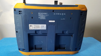 Back of a blue and yellow ruggedized fluke networks optiview xg network analysis tablet with battery compartments and labels