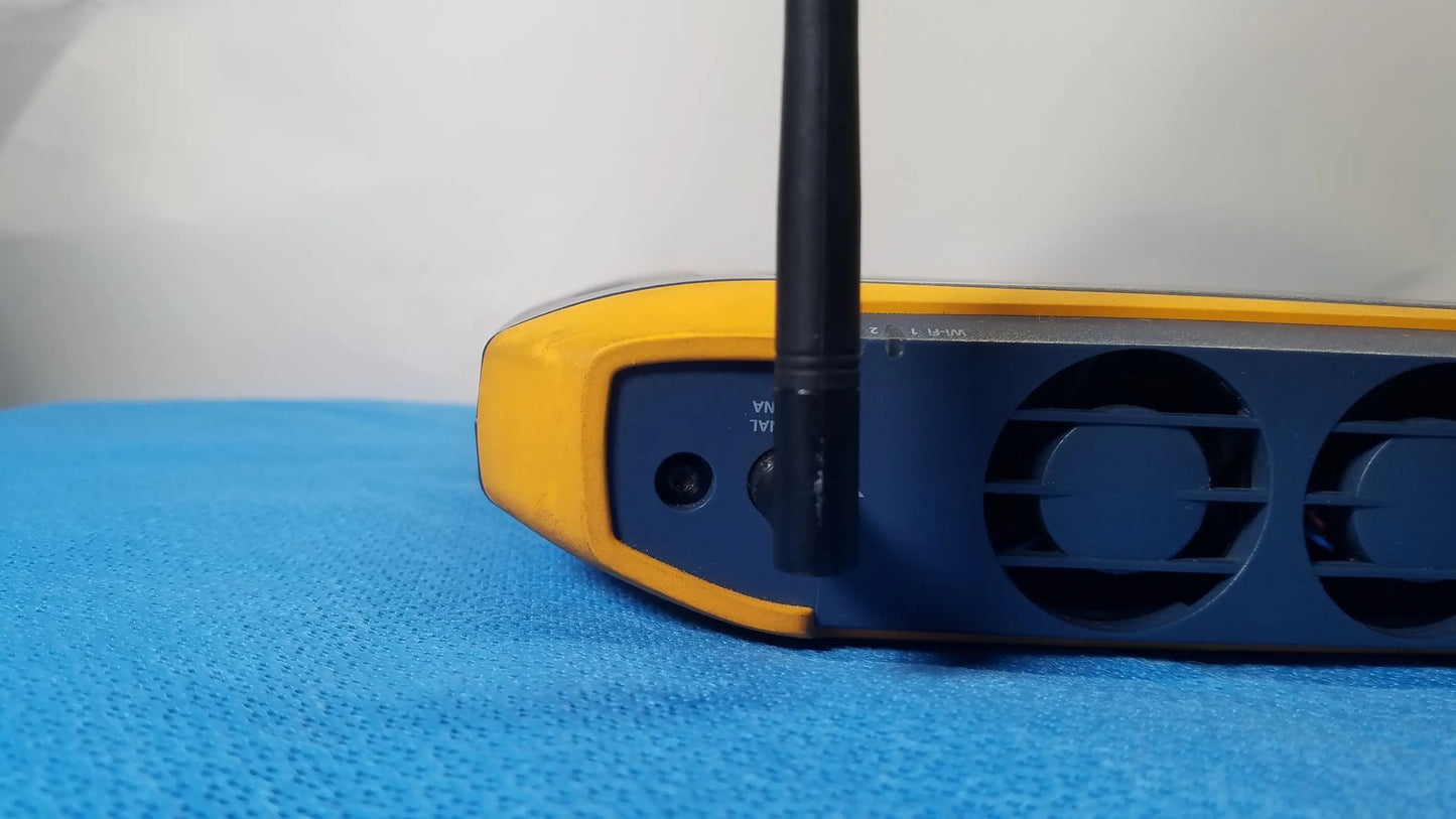 Yellow and black wireless router with single external antenna for fluke networks optiview xg network analysis tablet use