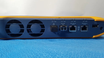 Back side of yellow and blue fluke networks optiview XG network analysis tablet showing ethernet ports usb port and ventilation grilles