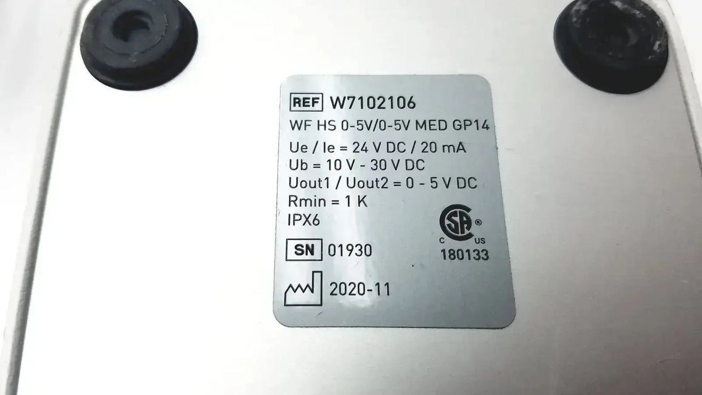 White rectangular label with black printed text and certification mark on the back of footswitch w7102106 with power cable used medical equipment for sale