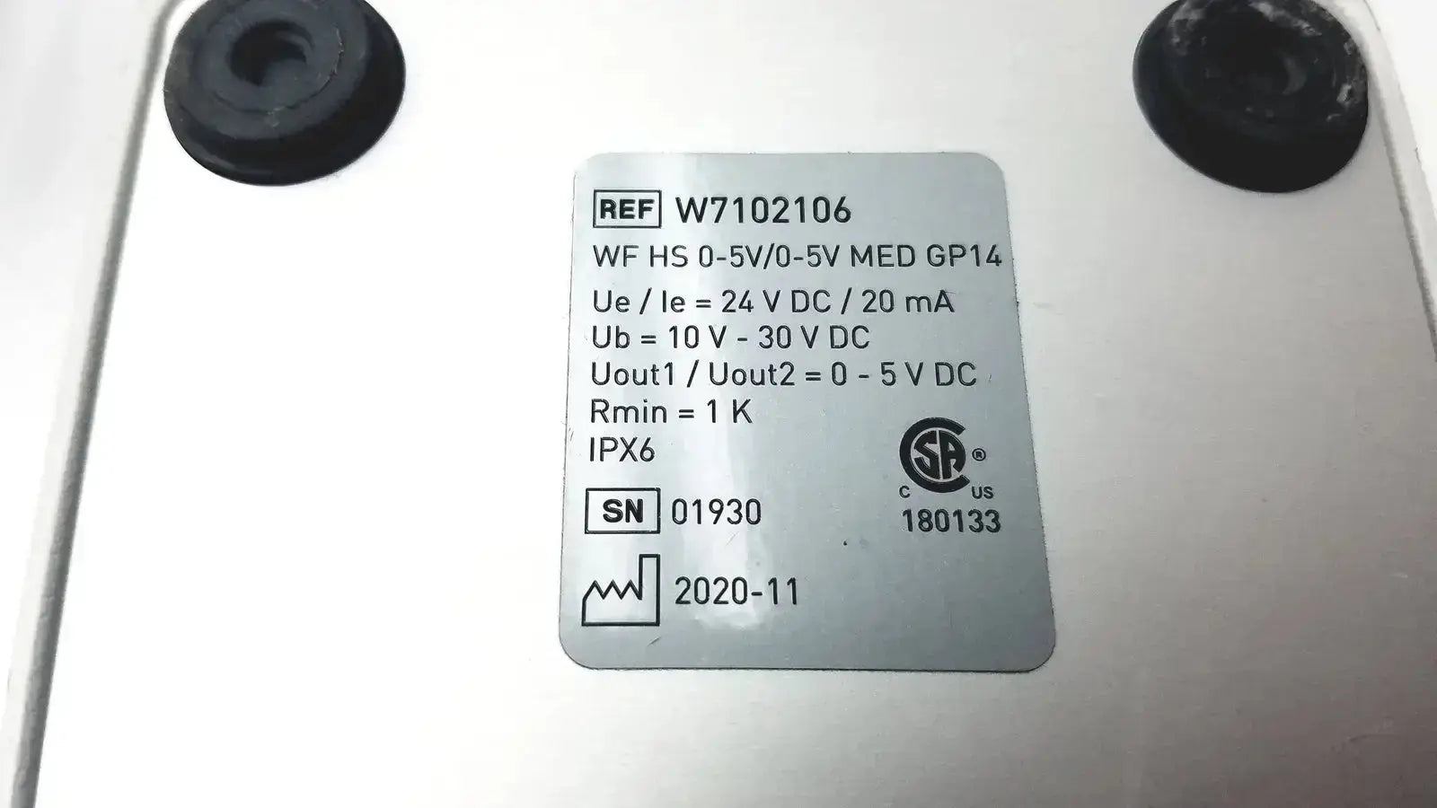White rectangular label with black printed text and certification mark on the back of footswitch w7102106 with power cable used medical equipment for sale