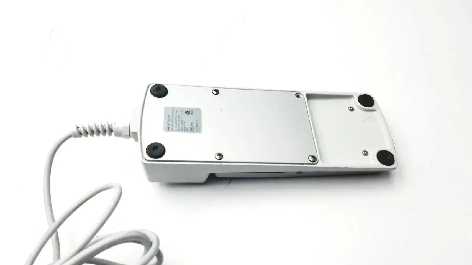 Footswitch w7102106 silver metallic foot pedal with black rubber feet and white coiled power cable used medical equipment for sale