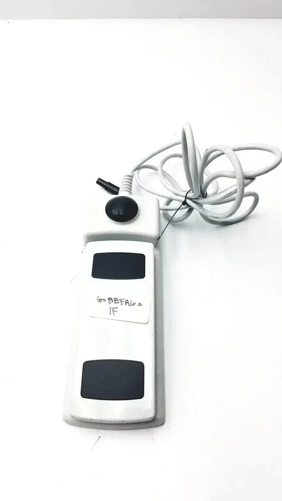 Footswitch w7102106 white plastic foot pedal with black buttons and coiled gray power cable used medical equipment for sale