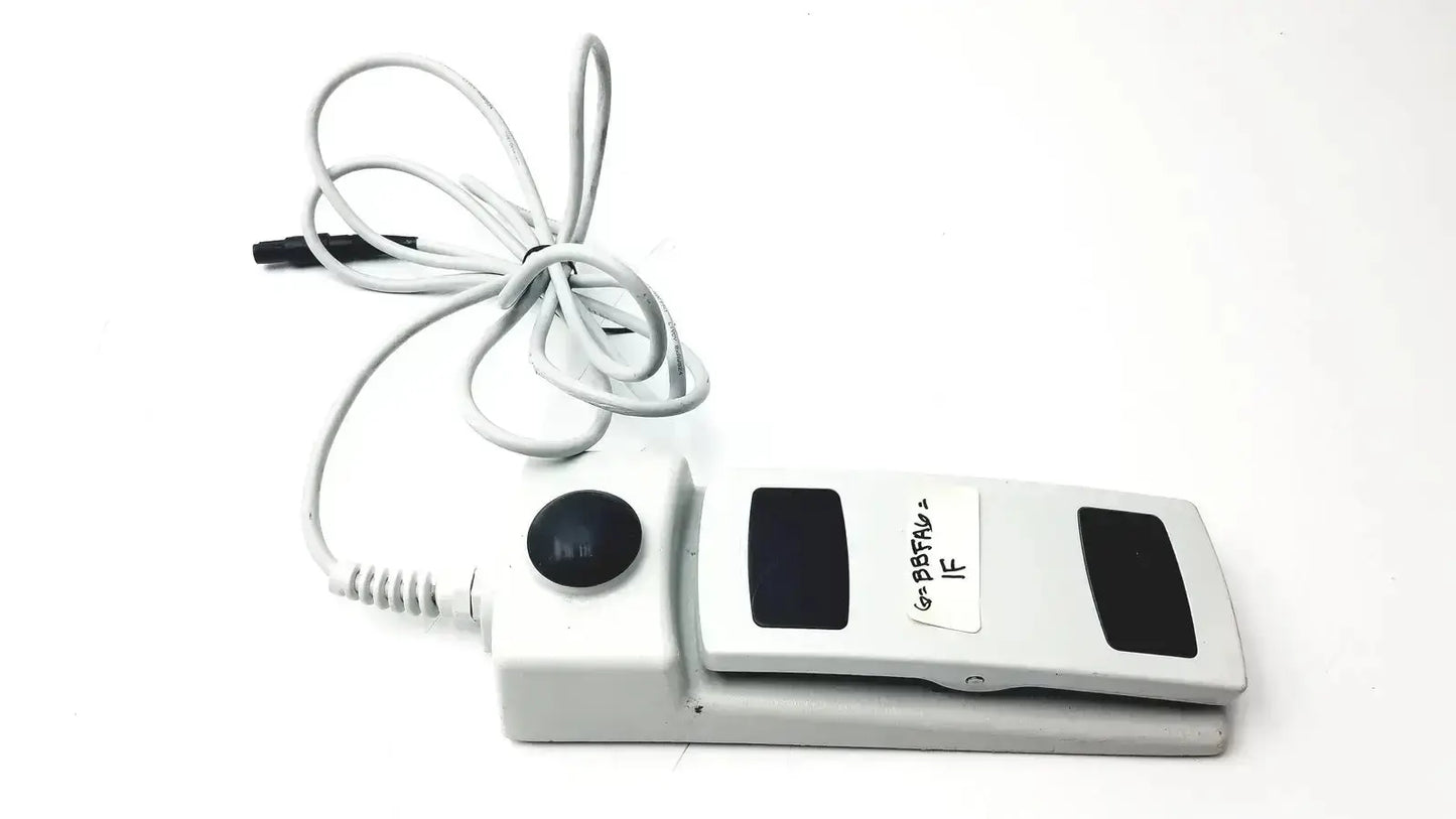 White footswitch w7102106 with power cable featuring black button and panels used medical equipment for sale