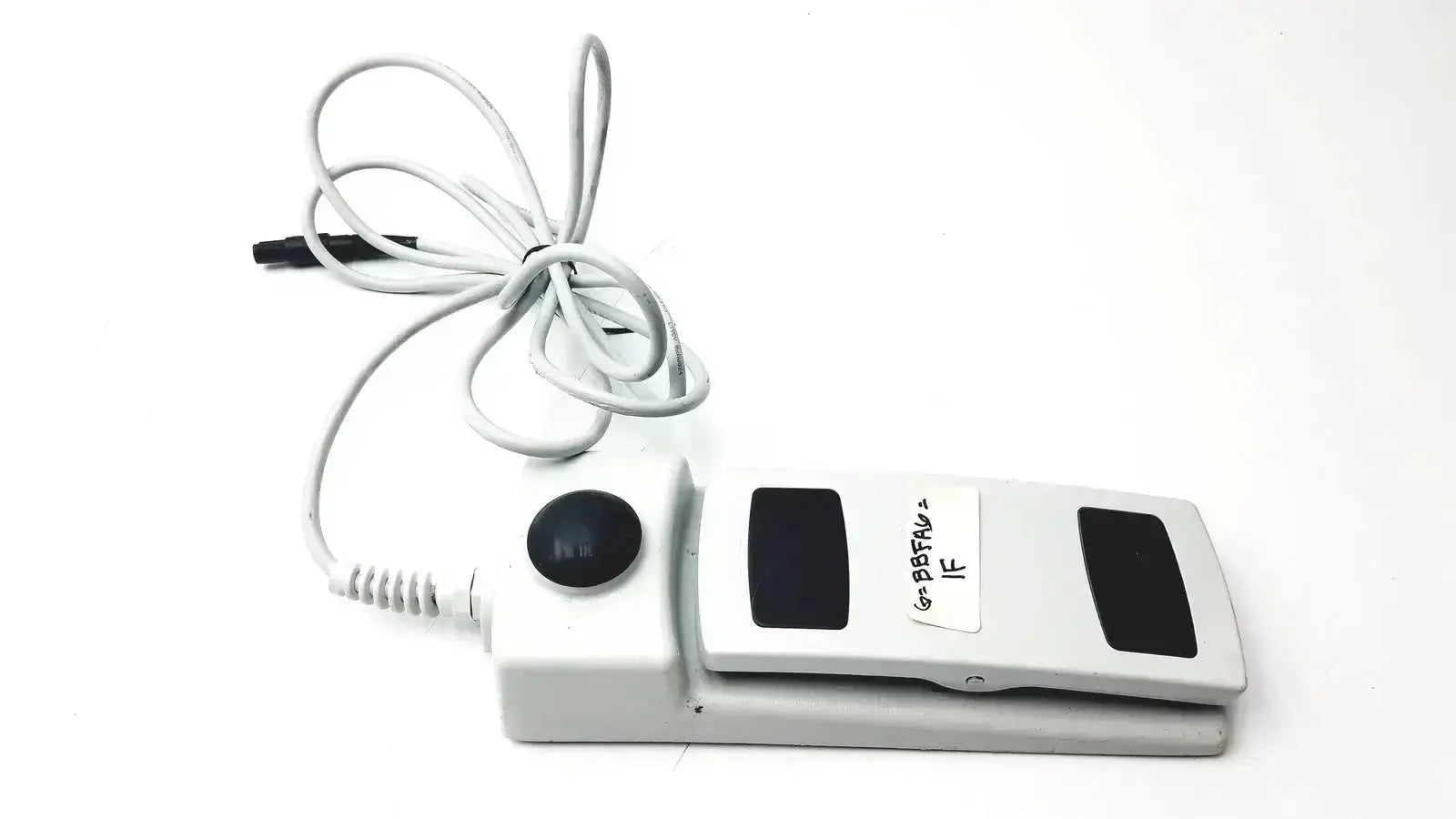 White footswitch w7102106 with power cable featuring black button and panels used medical equipment for sale