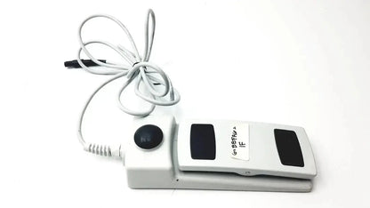 White footswitch w7102106 with power cable featuring black button and panels used medical equipment for sale