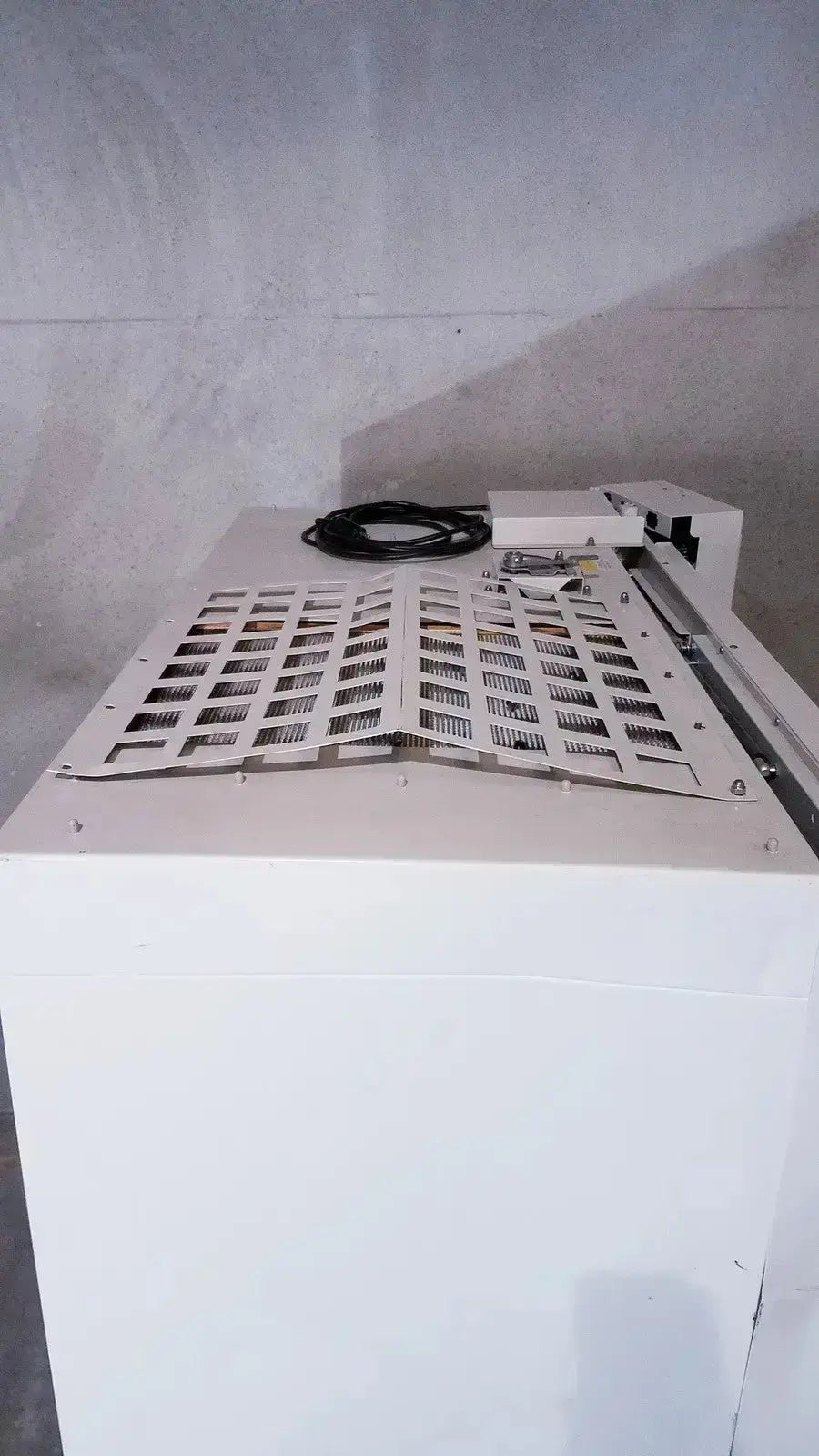 White Forma Scientific Class II A/B3 biological safety cabinet with perforated metal panel and coiled black cable on top