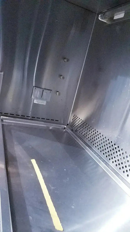 Interior of stainless steel Forma Scientific Class II A/B3 biological safety cabinet with perforated panel and yellow safety line