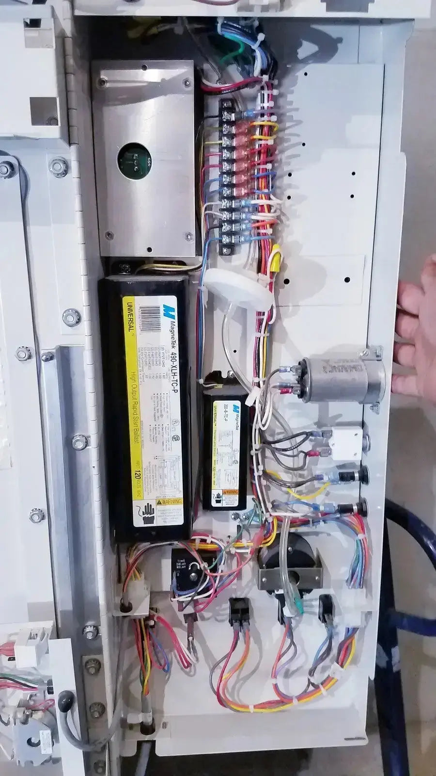 Silver metal electrical panel with colorful wiring in forma scientific biological safety cabinet for biological safety