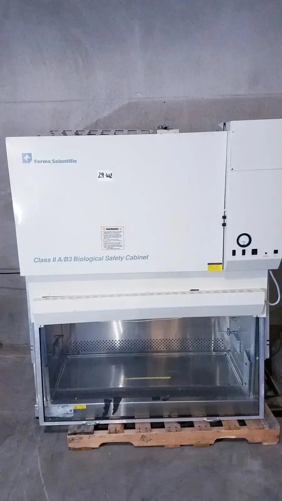 White Forma Scientific Class II a/b3 biological safety cabinet with glass front panel and stainless steel interior
