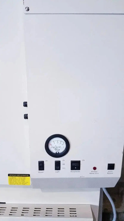 White industrial panel of forma scientific class ii a/b3 biological safety cabinet with pressure gauge and control switches