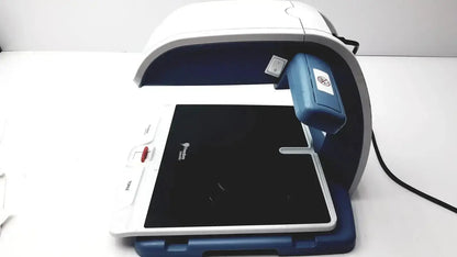 White and blue freedom scientific topaz xl hd regulatory model 10010 digital tablet scanner with black surface