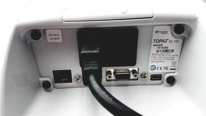 Back view of freedom scientific topaz xl hd white plastic device with power cable ethernet and vga connectors