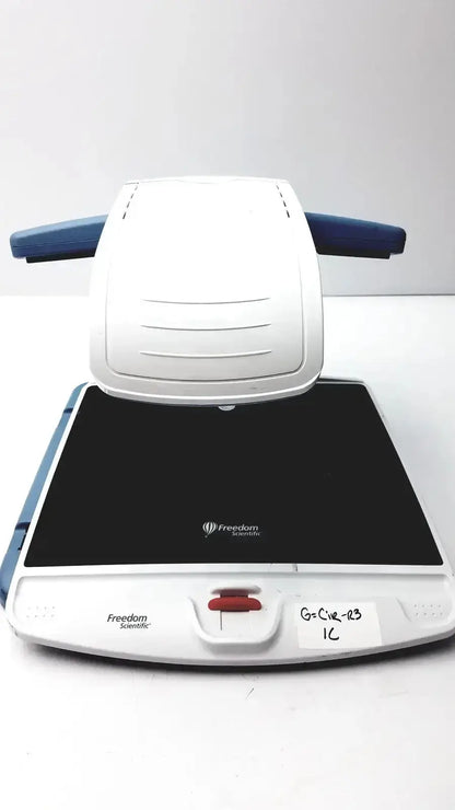 White and blue freedom scientific topaz xl hd regulatory model 10010 scanning device with black glass surface