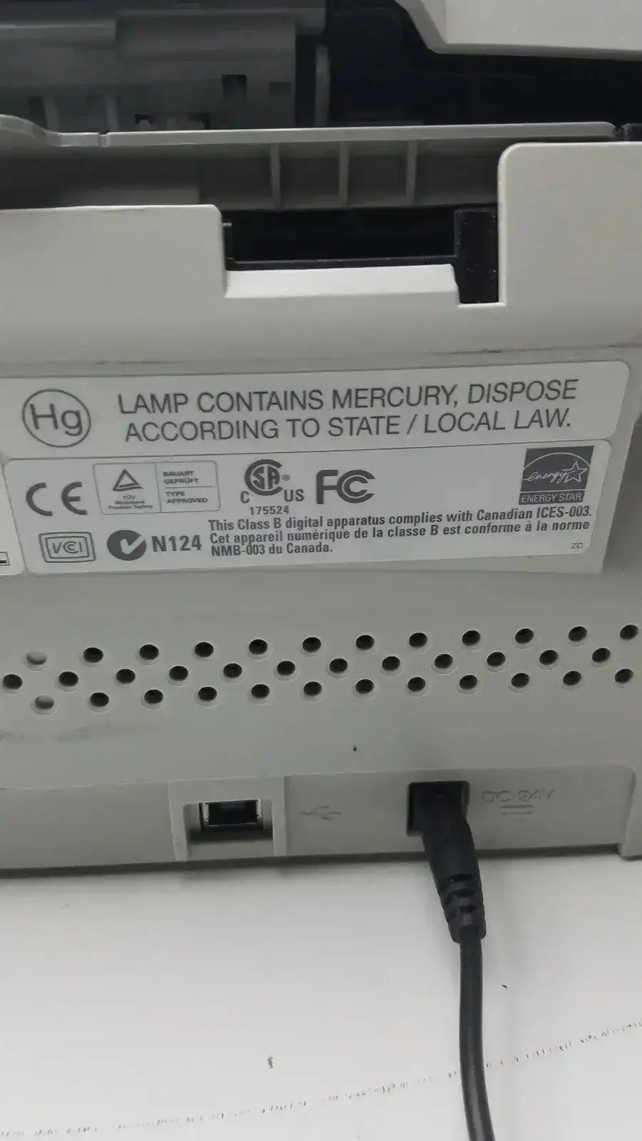 White plastic back panel of fujitsu fi-6130z high-speed duplex document scanner with ventilation holes and regulatory labels